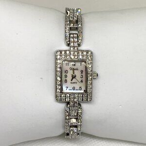 Xanadu quartz watch with silver tone crystal accented mop dial 18mm running